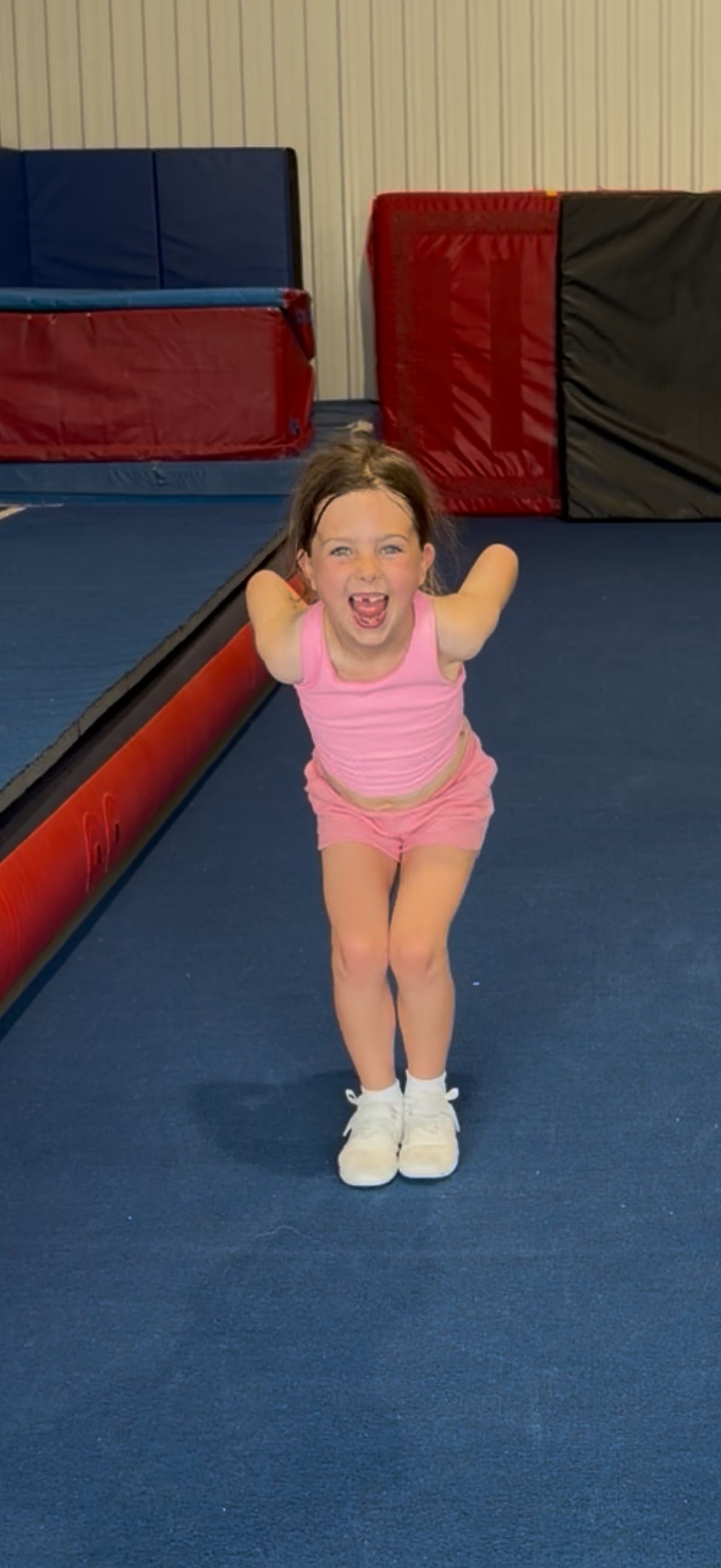 A young CheerCore Jags athlete smiling during class