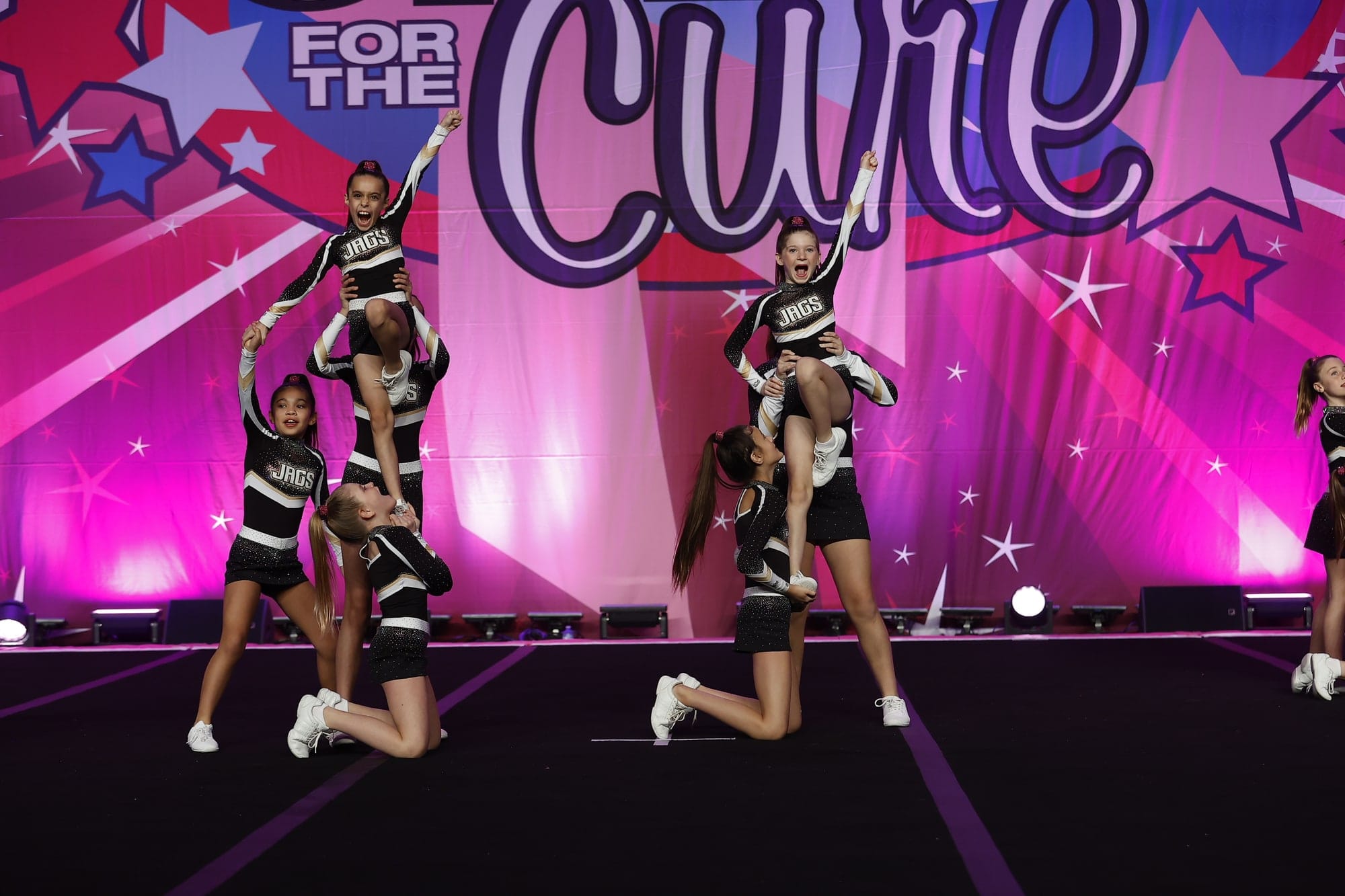 The Prep Cheer team hitting stunts across the competition floor