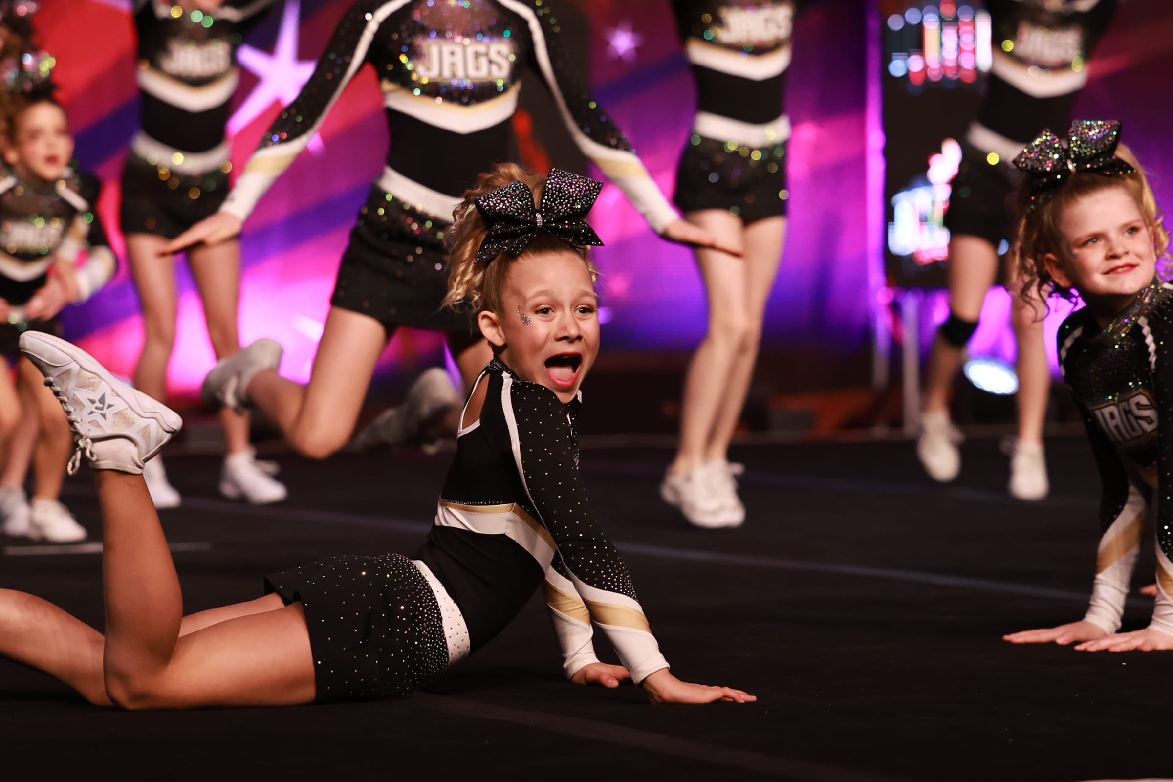 Young CheerCore Jags athlete mid-routine