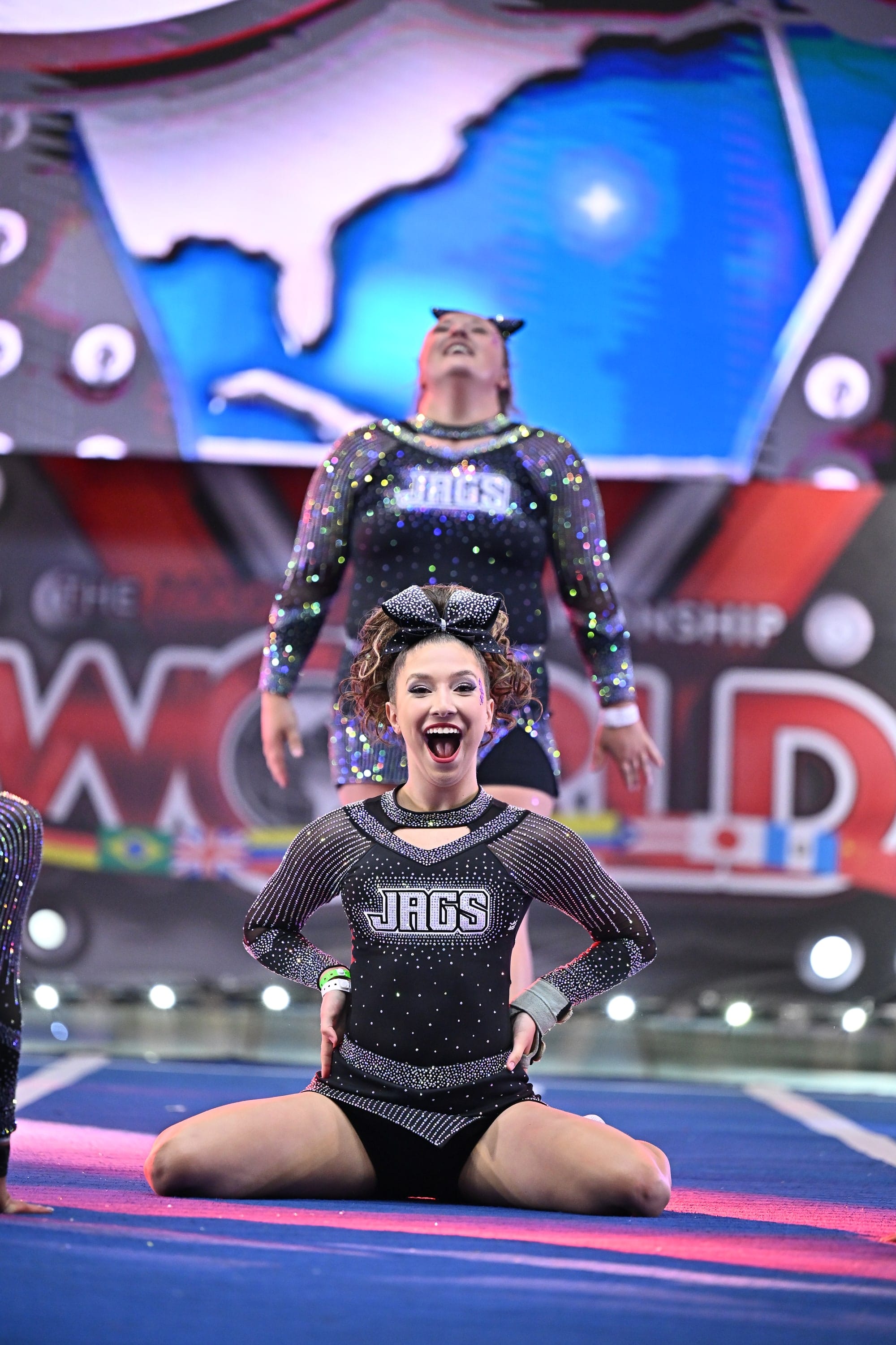 Elite Cheer athletes finishing their routine on the Worlds competition floor