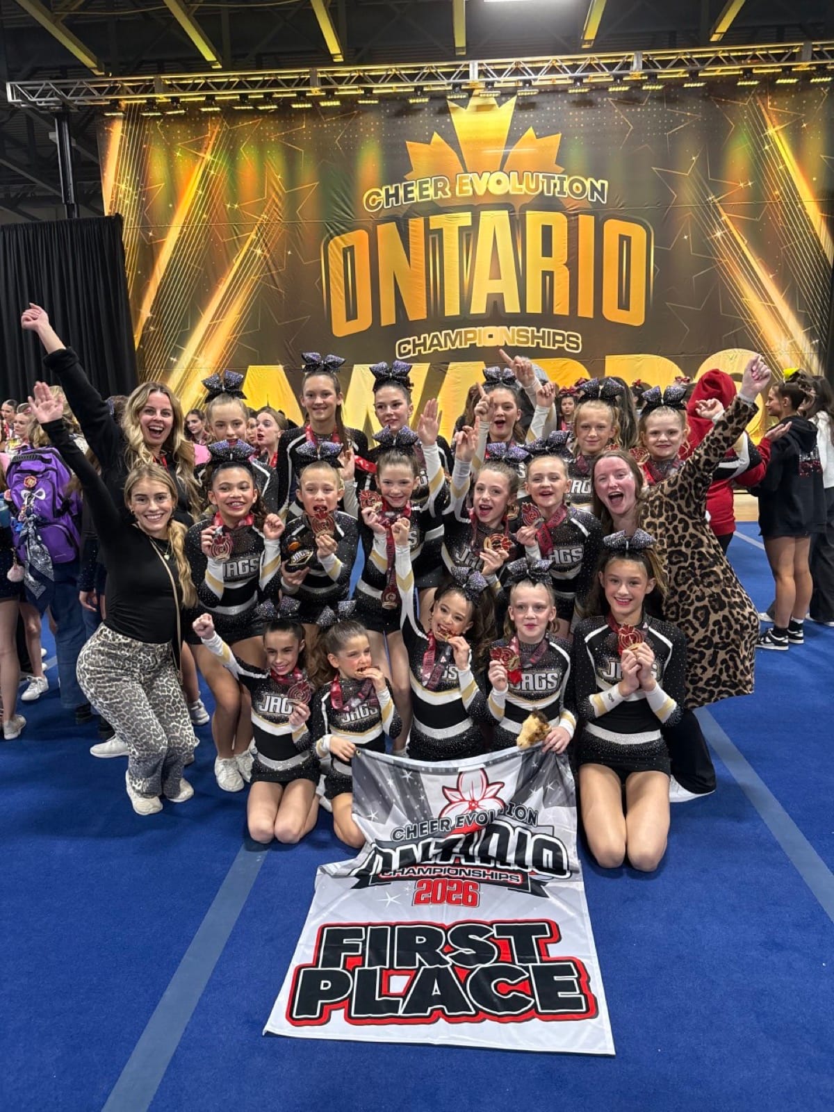 CheerCore Jags team celebrating a first place win at the Ontario Championships